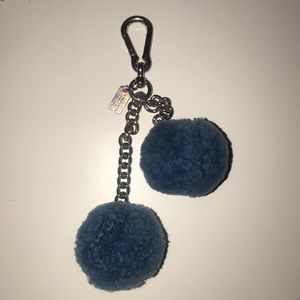 Coach Pom bag charm.